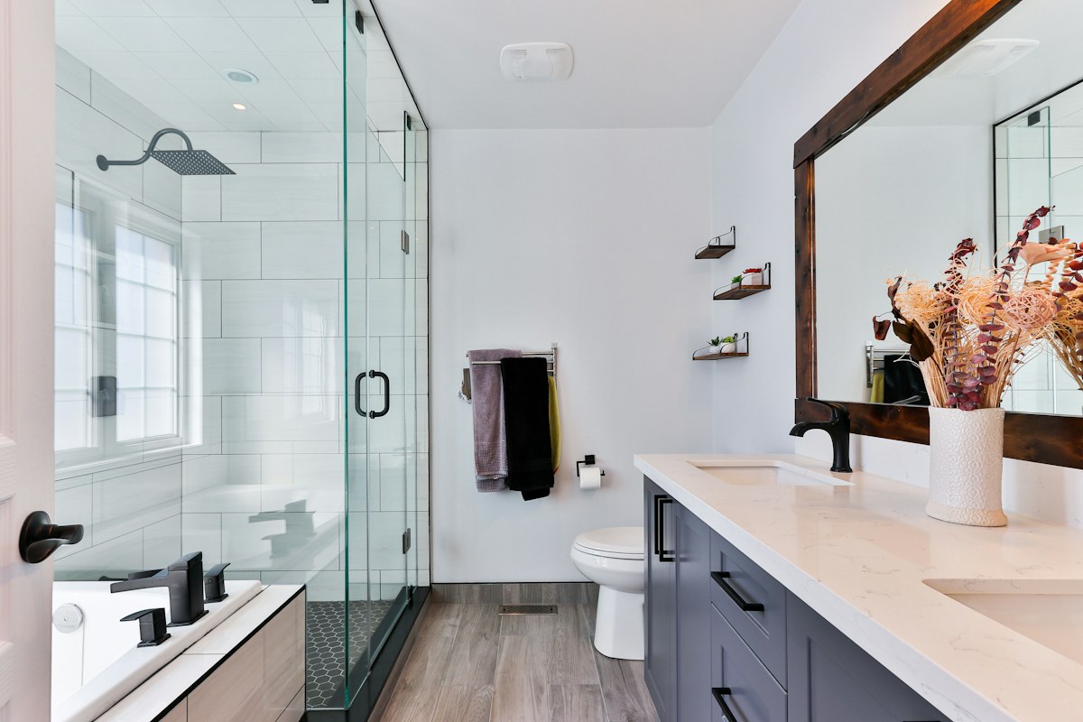 Clean tiled bathroom with glass shower
