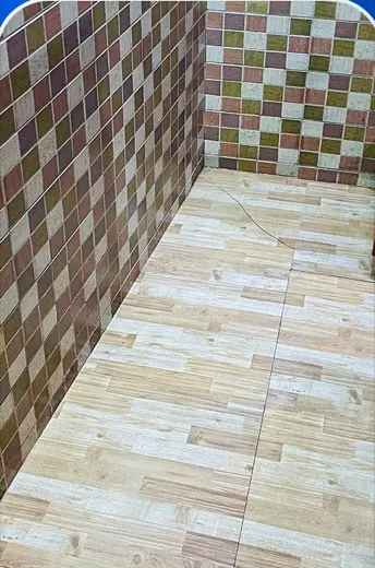 Tiled veranda floor with ingrained dirt across the surface before cleaning, and the same veranda floor clean and swept